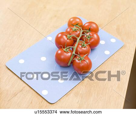 Tomatoes lying on a tray View Large Photo Image Picture - Tomatoes lying on a tray. Fotosearch