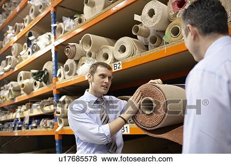 Stock Photo - Two businessmen in warehouse. Fotosearch