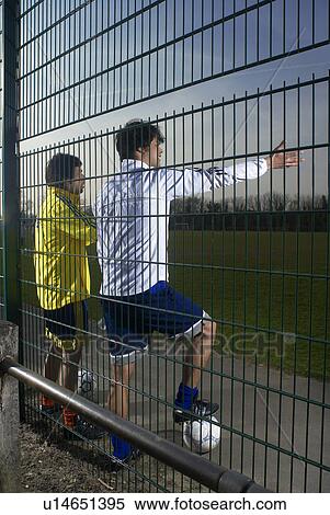 two footballers watching game View Large Photo Image Stock Photography - two footballers watching game. Fotosearch