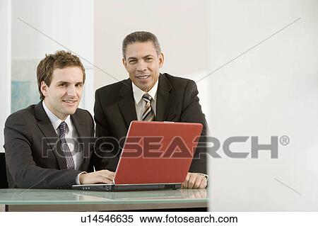 Two male business colleagues View Large Photo Image Stock Photography - Two male business colleagues. Fotosearch