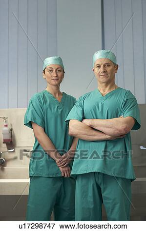Two medical staff in scrubs View Large Photo Image Stock Photo - Two medical staff in scrubs. Fotosearch
