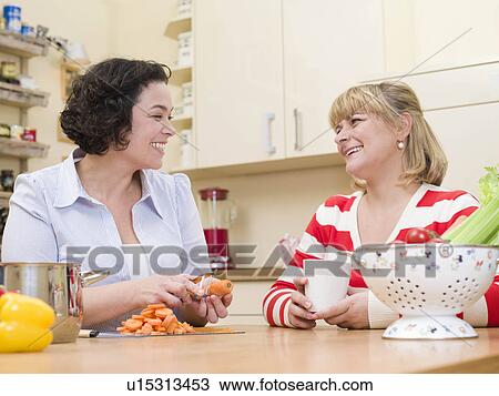 Two women cooking. View Large Photo Image Stock Image - Two women cooking.. Fotosearch