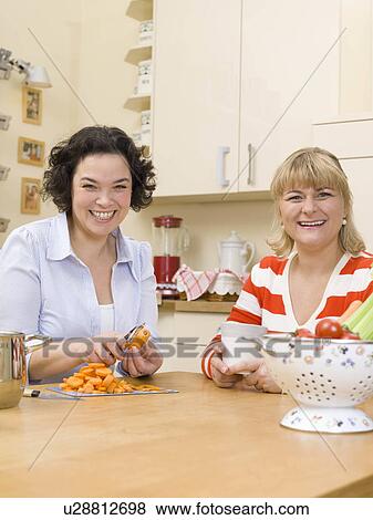 Two women cooking. View Large Photo Image Stock Photo - Two women cooking.. Fotosearch