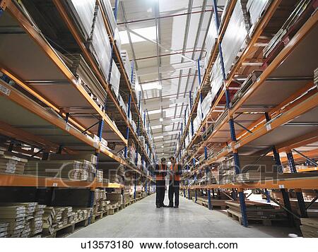 Two Workers In Warehouse View Large Photo Image Stock Image - Two Workers In Warehouse. Fotosearch