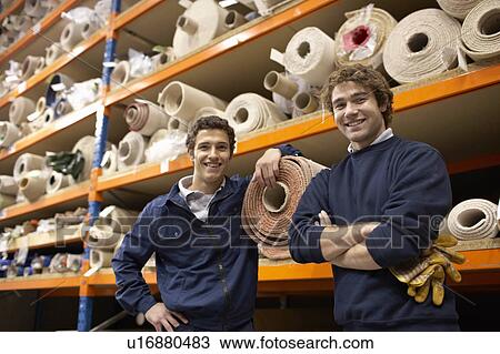 Two workers in warehouse View Large Photo Image Stock Image - Two workers in warehouse. Fotosearch