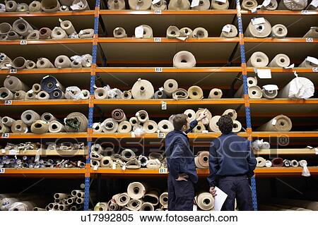 Stock Photography - Two workers in warehouse. Fotosearch