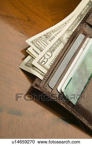 Stock Image - Us currency and credit cards. Fotosearch