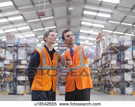 Warehouse Manager Instructing Worker View Large Photo Image Stock Photography - Warehouse Manager Instructing Worker. Fotosearch