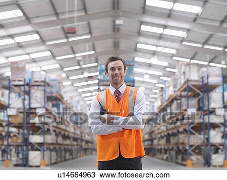 Warehouse Manager With Walkie Talkie View Large Photo Image Stock Image - Warehouse Manager With Walkie Talkie. Fotosearch