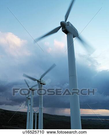 Wind turbines against stormy sky View Large Photo Image Stock Image - Wind turbines against stormy sky. Fotosearch