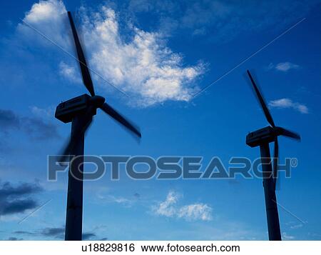 Wind turbines in silhouette View Large Photo Image Stock Photograph - Wind turbines in silhouette. Fotosearch