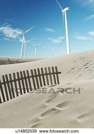 Wind turbines with sand dunes View Large Photo Image Stock Photo - Wind turbines with sand dunes. Fotosearch