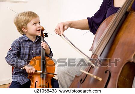 woman and boy playing Cello View Large Photo Image Stock Image - woman and boy playing Cello. Fotosearch