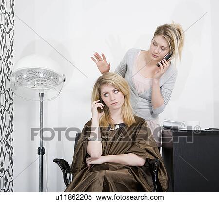 Woman and hair stylist on phones View Large Photo Image Stock Photography - Woman and hair stylist on phones. Fotosearch