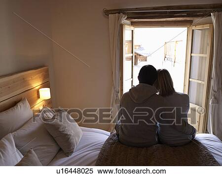 woman and man sitting on bed View Large Photo Image Stock Photography - woman and man sitting on bed. Fotosearch