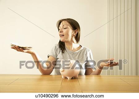 woman balancing money View Large Photo Image Stock Photograph - woman balancing money. Fotosearch