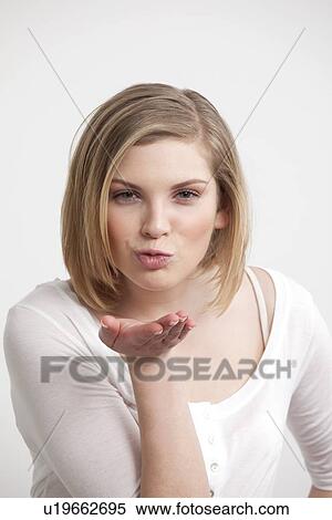 Woman blowing a kiss View Large Photo Image Stock Photography - Woman blowing a kiss. Fotosearch