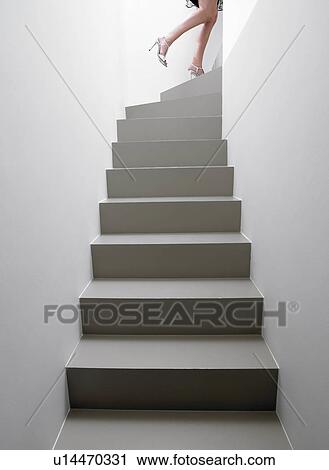Woman climbing the stairs View Large Photo Image Stock Image - Woman climbing the stairs. Fotosearch