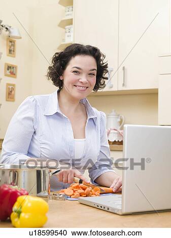 woman cutting vegetables View Large Photo Image Stock Image - woman cutting vegetables. Fotosearch