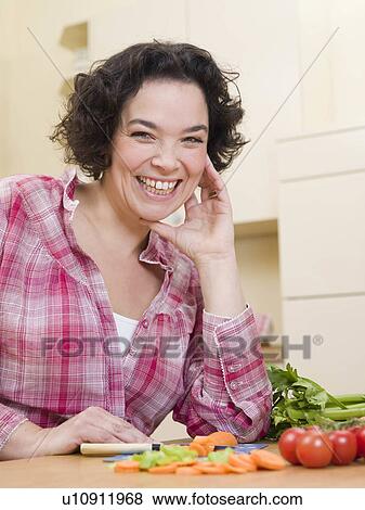 woman cutting vegetables View Large Photo Image Stock Photo - woman cutting vegetables. Fotosearch