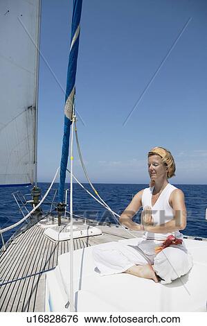 Woman doing yoga on Sailing Boat View Large Photo Image Stock Photograph - Woman doing yoga on Sailing Boat. Fotosearch