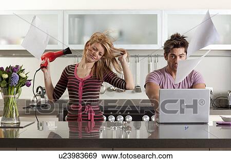 woman drying hair next to partner View Large Photo Image Stock Photo - woman drying hair next to partner. Fotosearch