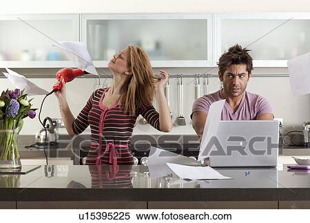 Stock Photography - woman drying hair next to partner. Fotosearch