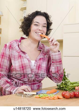 woman eating carrot View Large Photo Image Stock Image - woman eating carrot. Fotosearch