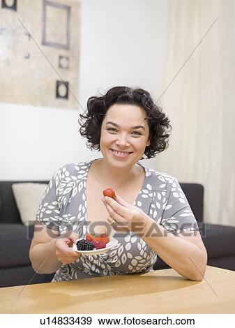 Woman eating fruit. View Large Photo Image Stock Photo - Woman eating fruit.. Fotosearch