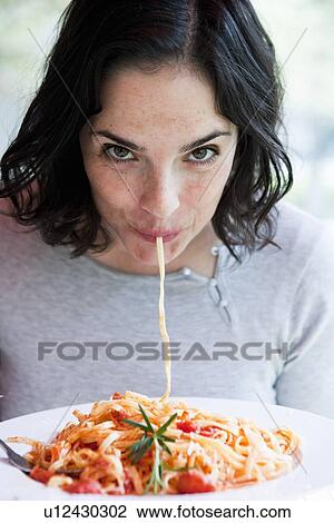 Woman Eating Spaghetti View Large Photo Image Stock Image - Woman Eating Spaghetti. Fotosearch