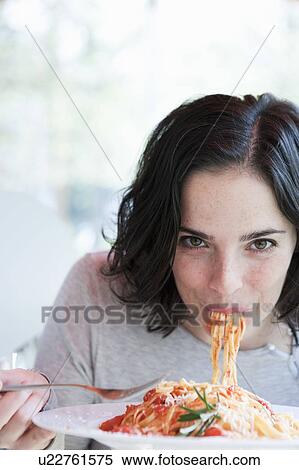 Woman Eating Spaghetti View Large Photo Image Stock Photography - Woman Eating Spaghetti. Fotosearch