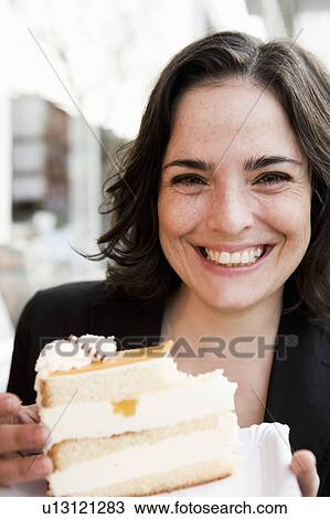 Stock Image - Woman Eating Tart. Fotosearch