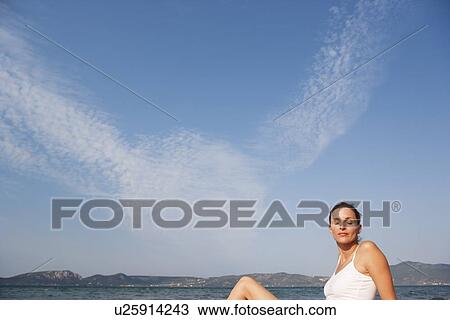 Stock Image - Woman Enjoying Sun. Fotosearch