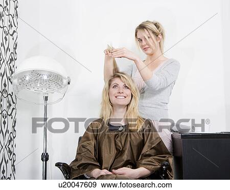 Stock Photo - Woman having haircut. Fotosearch