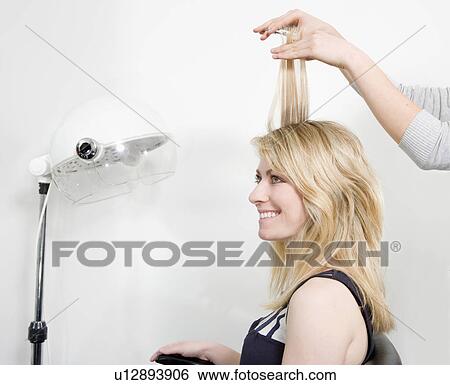 Woman having haircut View Large Photo Image Stock Photograph - Woman having haircut. Fotosearch