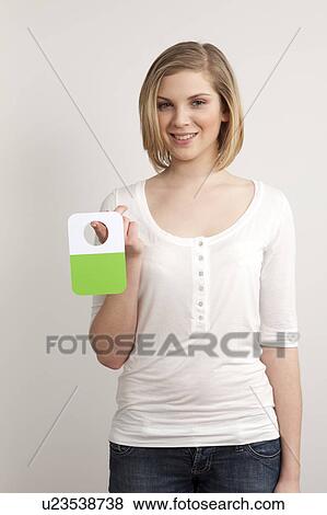 Woman holding a green card View Large Photo Image Stock Photo - Woman holding a green card. Fotosearch