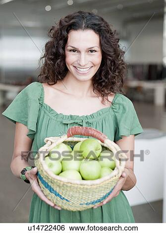 woman holding basket of apples View Large Photo Image Stock Photograph - woman holding basket of apples. Fotosearch