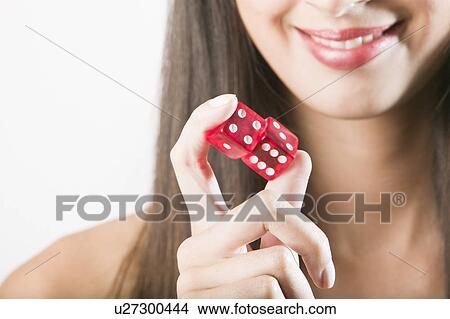Woman holding red dice View Large Photo Image Picture - Woman holding red dice. Fotosearch