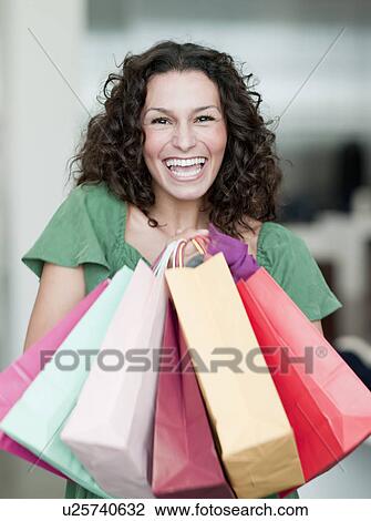 woman holding shopping bags View Large Photo Image Stock Image - woman holding shopping bags. Fotosearch