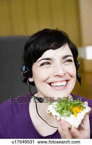woman in office having a snack View Large Photo Image Stock Image - woman in office having a snack. Fotosearch