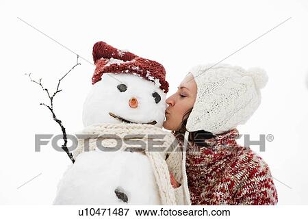 woman kissing snowman View Large Photo Image Stock Photo - woman kissing snowman. Fotosearch