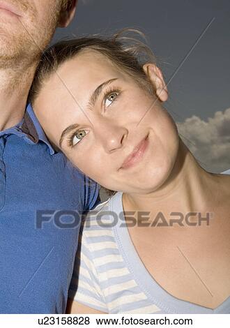 Stock Photo - Woman Leaning against Man. Fotosearch