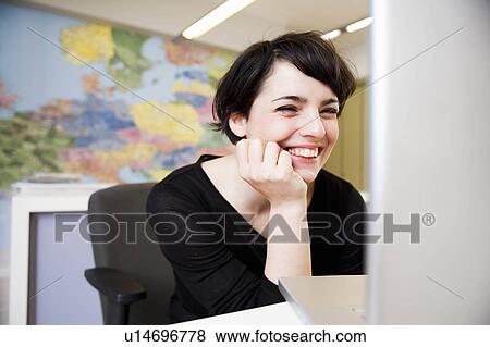 woman looking at computer View Large Photo Image Stock Photo - woman looking at computer. Fotosearch