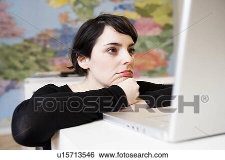 woman looking at computer View Large Photo Image Stock Photograph - woman looking at computer. Fotosearch