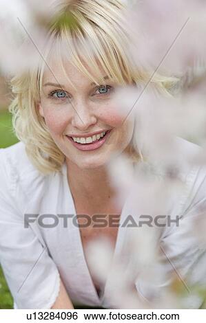 woman looking up at viewer View Large Photo Image Stock Photograph - woman looking up at viewer. Fotosearch