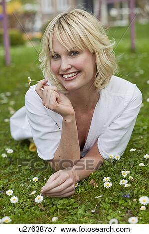 woman lying in garden View Large Photo Image Stock Photo - woman lying in garden. Fotosearch