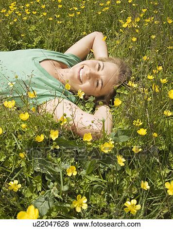 Woman Lying in Meadow View Large Photo Image Stock Photo - Woman Lying in Meadow. Fotosearch
