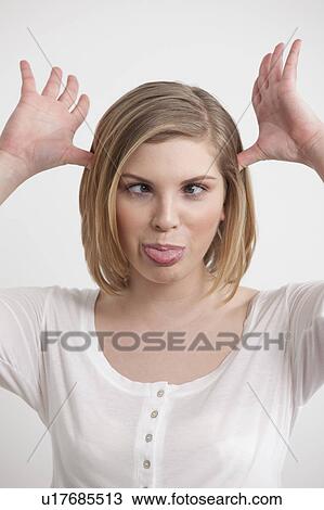 Woman making a funny face View Large Photo Image Stock Image - Woman making a funny face. Fotosearch