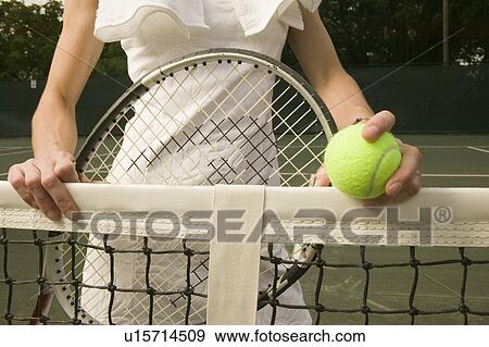 Woman on tennis court View Large Photo Image Stock Photo - Woman on tennis court. Fotosearch