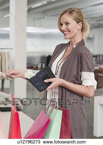 woman paying for her shopping items View Large Photo Image Stock Image - woman paying for her shopping items. Fotosearch